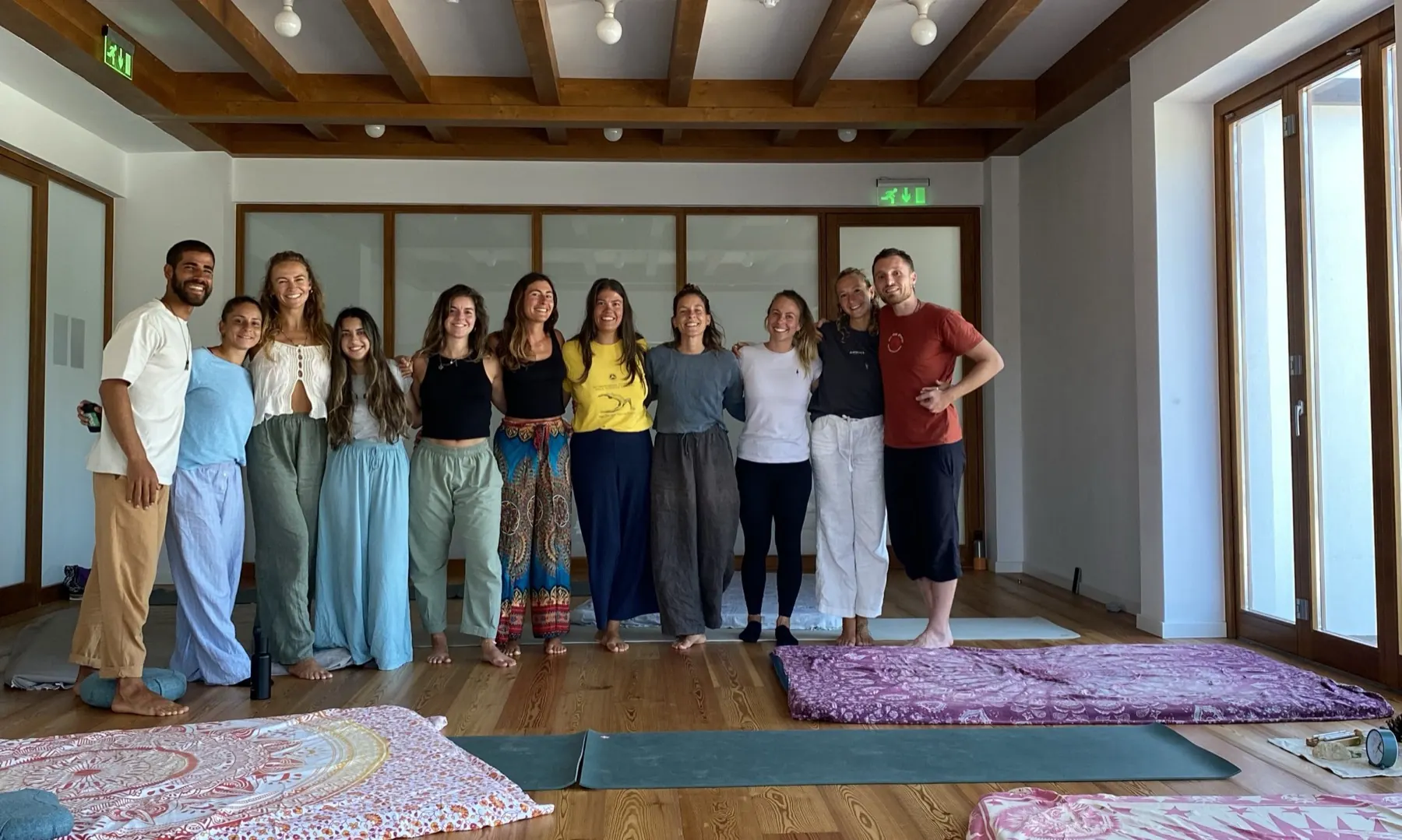 Participants of the Introduction to Zenthai Shiatsu workshop at Mandala in Sagres, Portugal, standing together on the studio floor