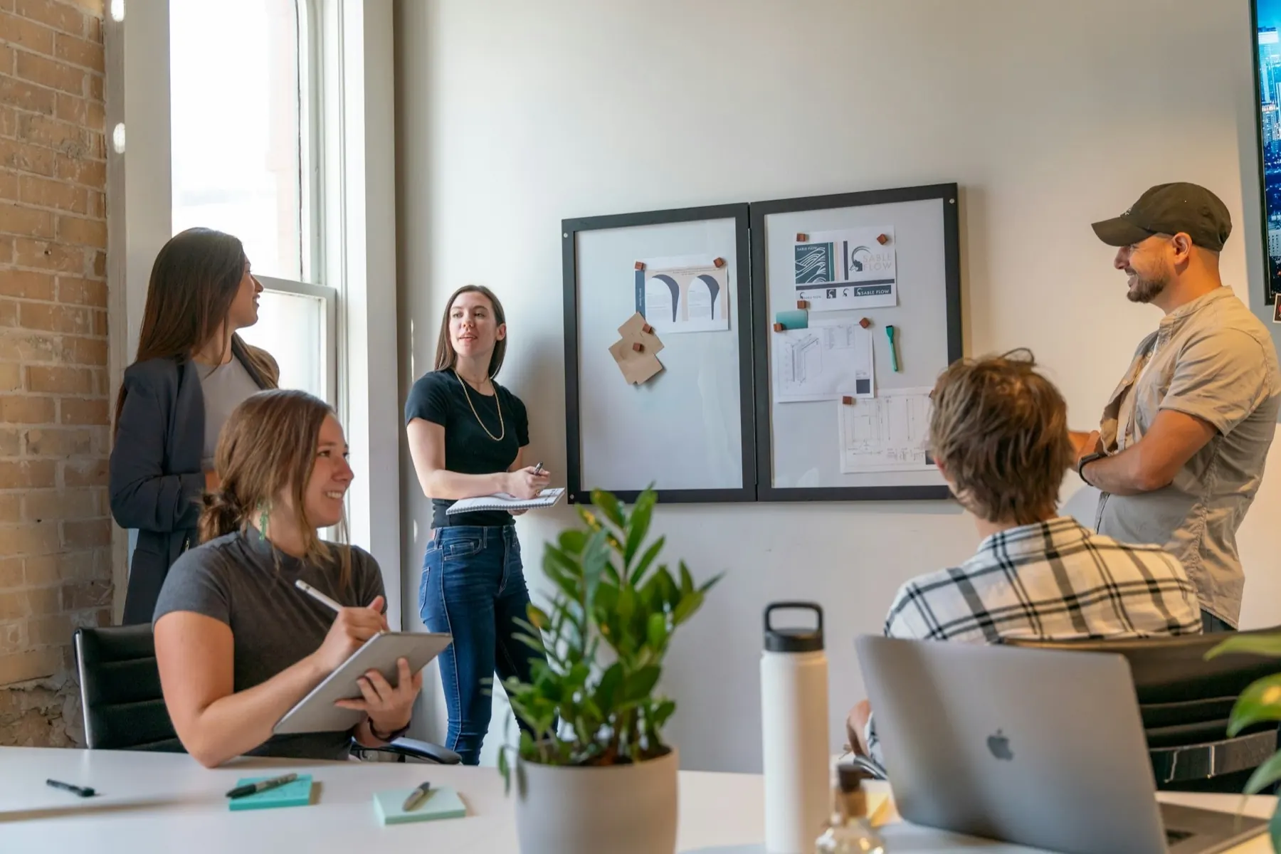 A team talking through ideas together in a sunlit office